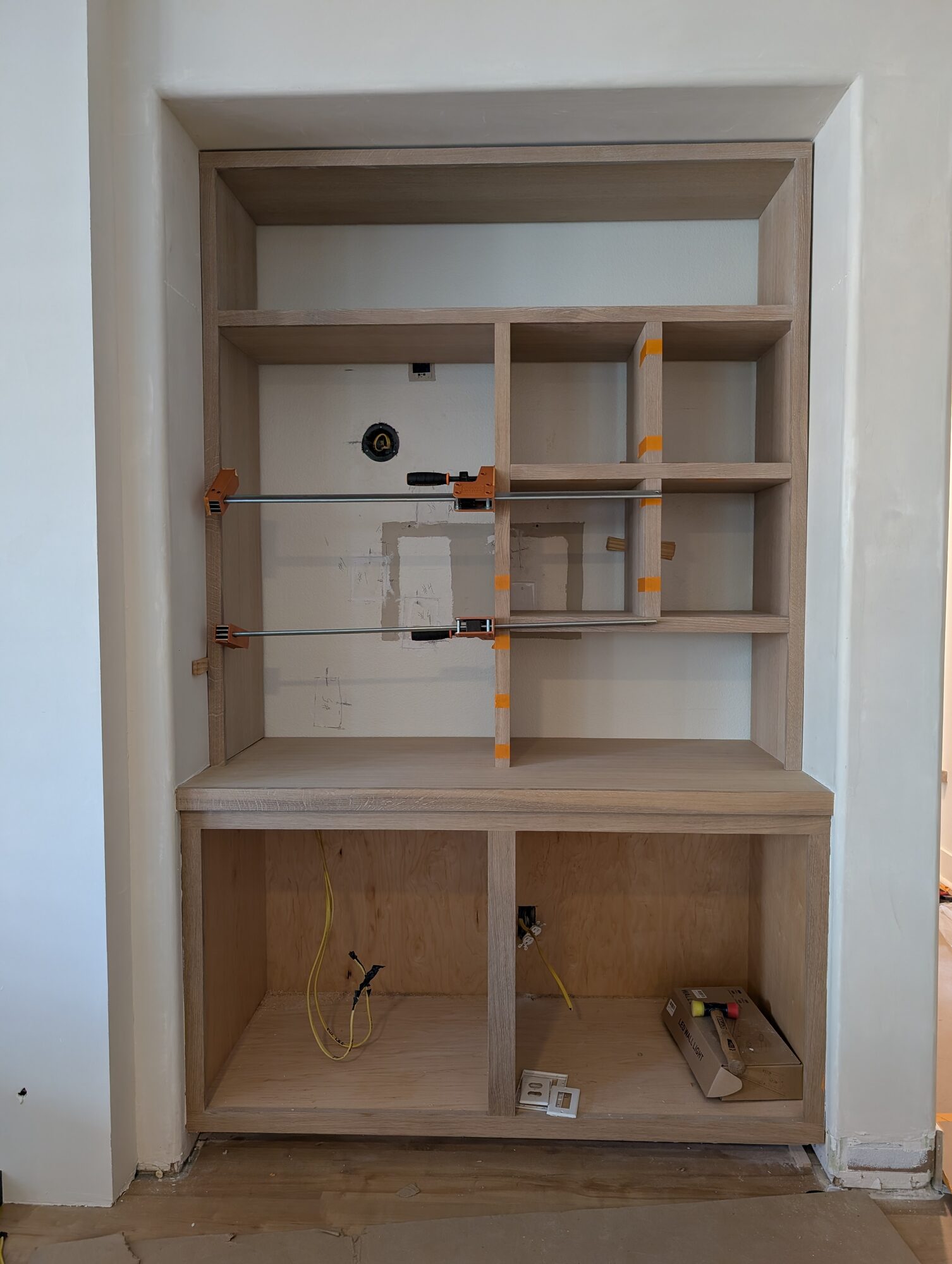 Oak cubby panels clamped up during install above the base cabinet and solid oak countertop, Winchester CA