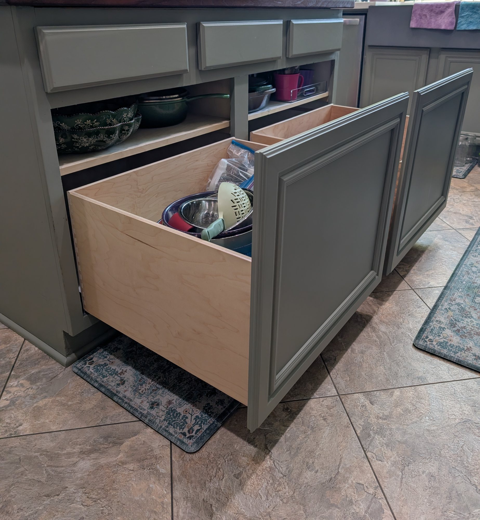 Two retrofit deep pull-out drawers with dovetailed Baltic birch boxes in a Menifee kitchen island