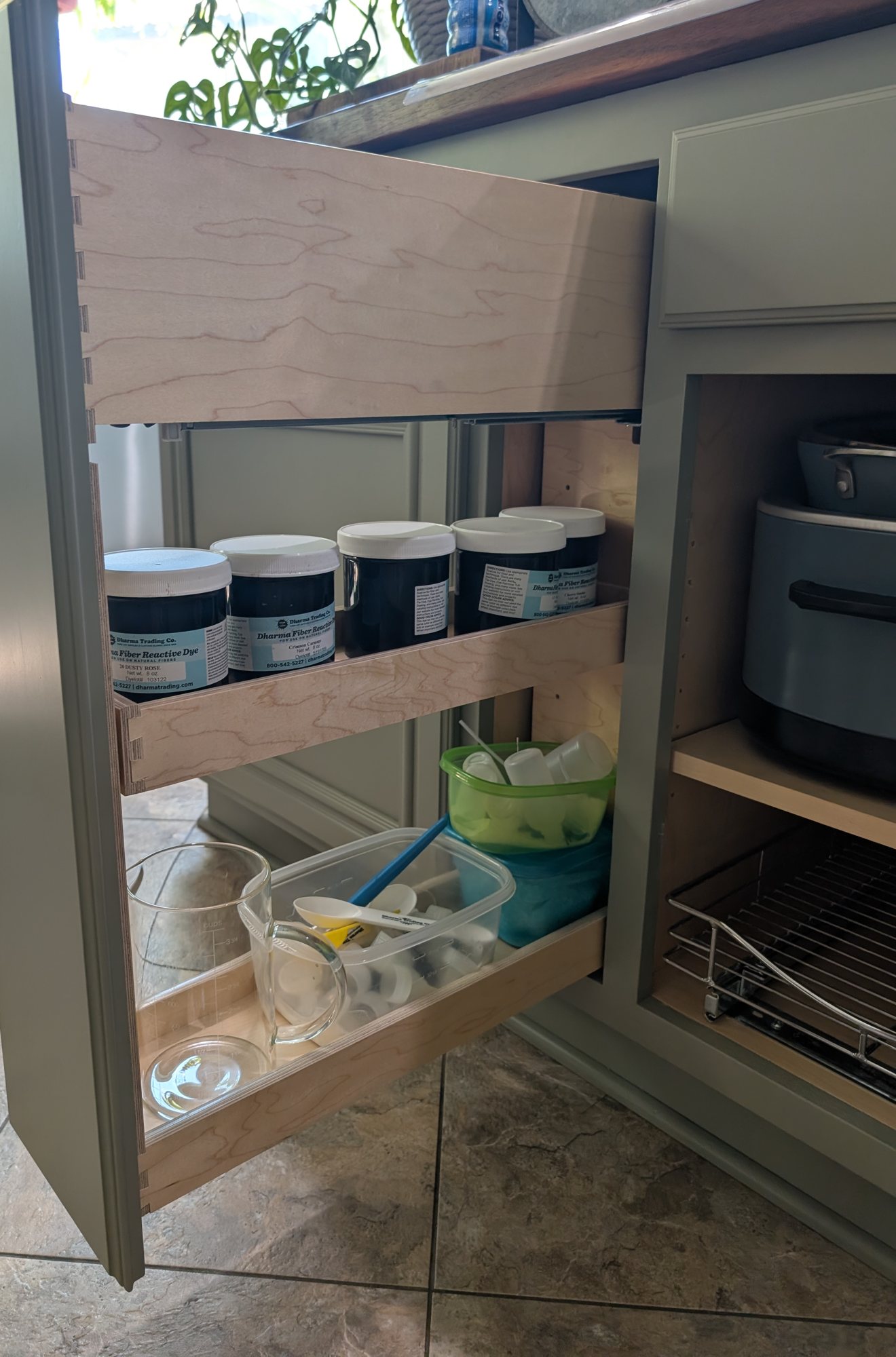 Tall narrow kitchen island pull-out with tiered maple shelves for jar storage, Menifee CA