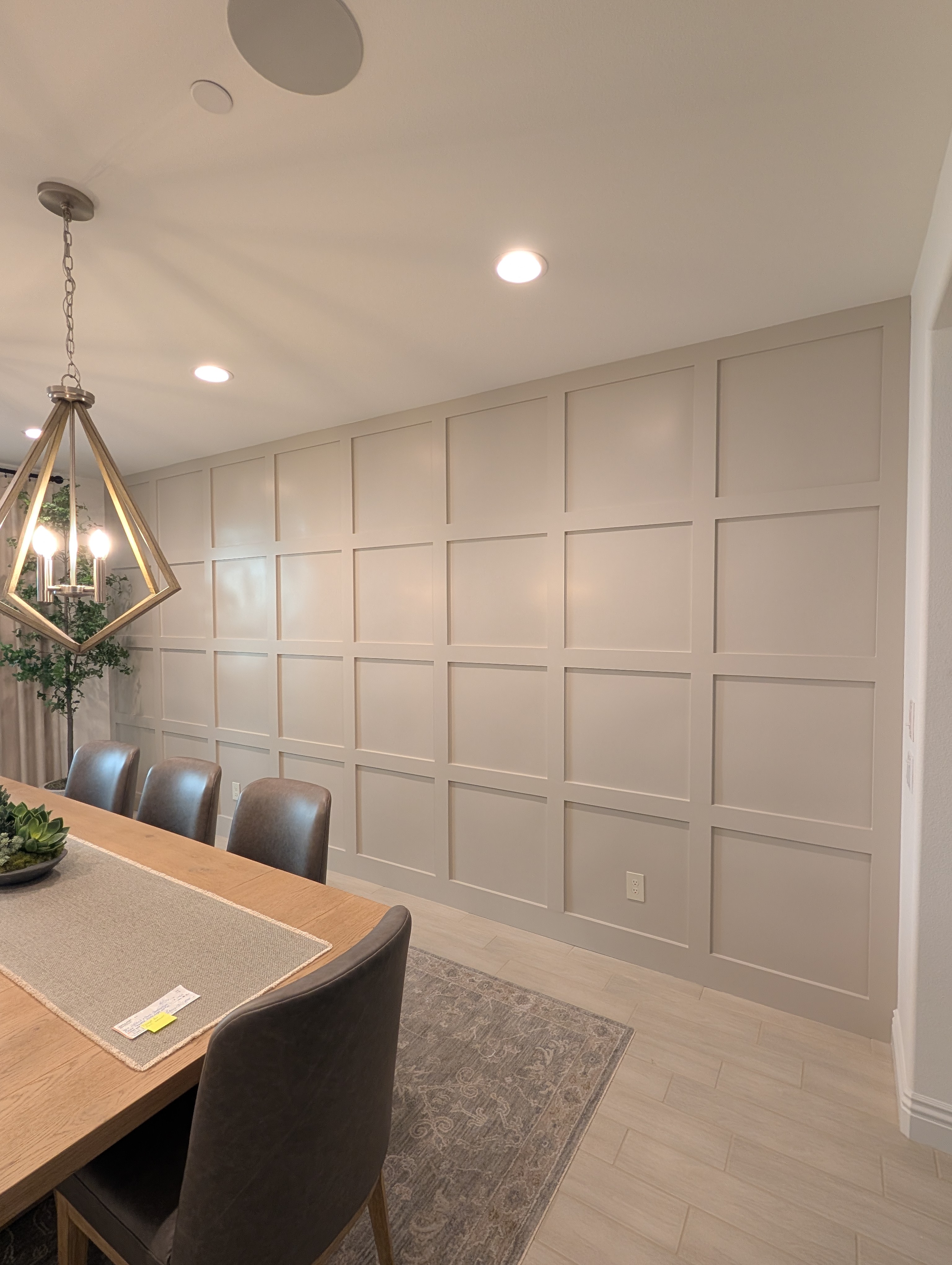 The finished accent wall with the dining table and chandelier back in place, Menifee CA