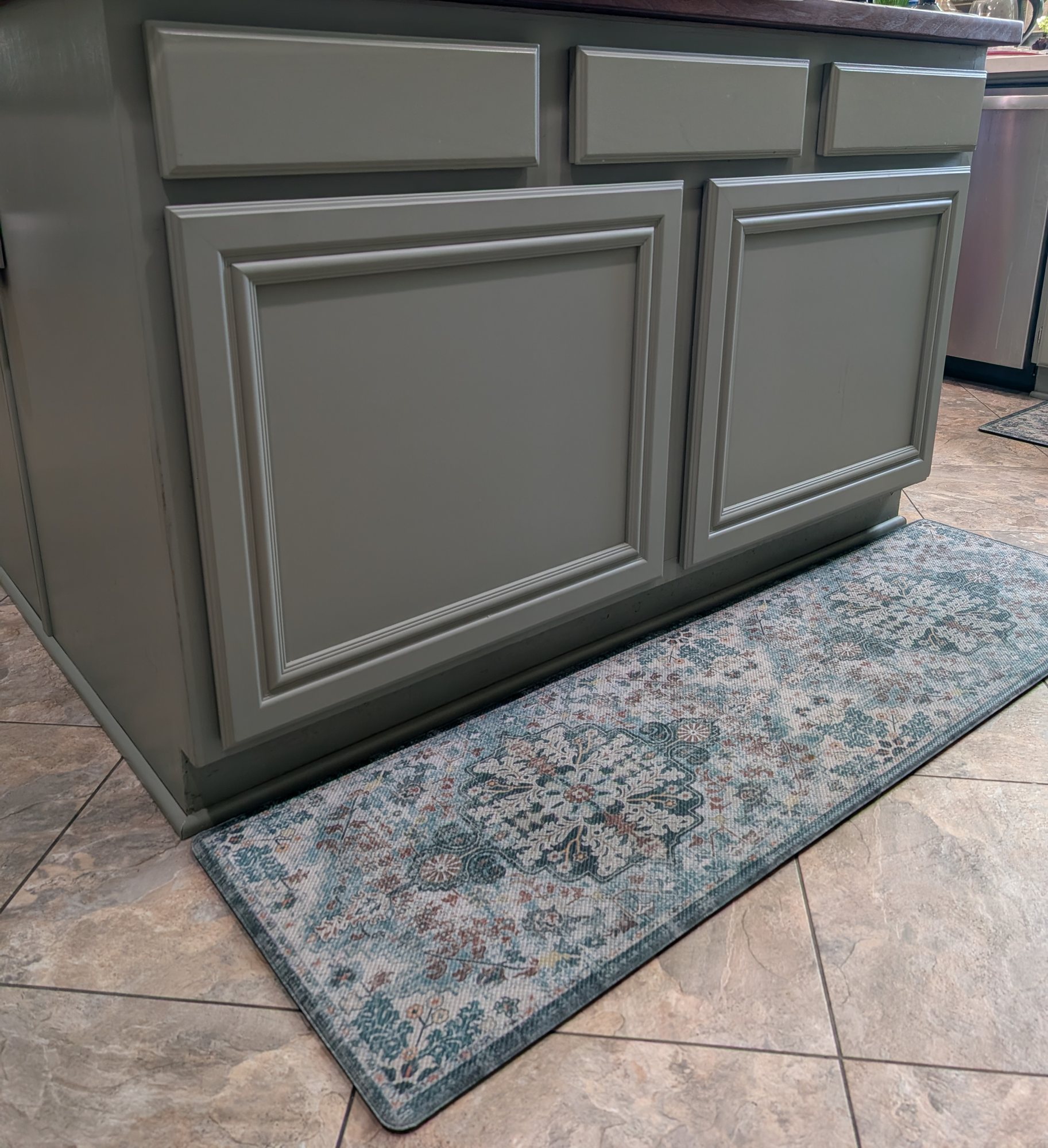 Kitchen island with matching painted doors and drawer fronts after a pull-out retrofit in Menifee, CA